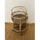 A Bentwood wicker two tier trolly (H67cm Dia42cm)