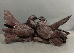 A sculpture of two cast love birds (W33cm)