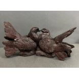 A sculpture of two cast love birds (W33cm)