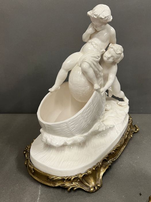 A table centre piece of a cherub pushing a shell into the sea on metal base (H38cm W40cm) - Image 2 of 6