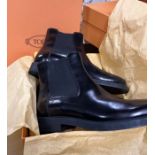 A pair of black ankle boots by Tod's