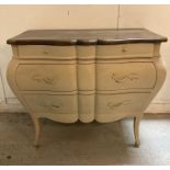 A Louis XV style Bombe commode with three drawers on splayed legs (H89cm W104cm D56cm)