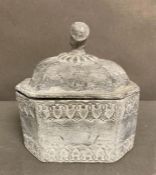 A 19th century lead tobacco jar with head finial