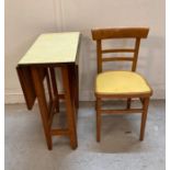 A Formica gate leg kitchen table and single chair