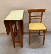 A Formica gate leg kitchen table and single chair