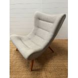An oversized Mid Century style curved shape lounge chair (H102cm W91cm D100cm)
