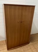 A teak Mid Century wardrobe, hanging rail to left and shelves to right (H150cm W95cm D59cm)