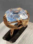 A synthetic aquamarine dress ring on a 9ct gold setting Size M 1/2 (Approximate Total weight 11.6g)