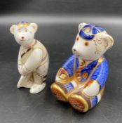 Two boxed Royal Crown Derby paperweights, Cricketer and school boy Teddy, one with gold stopper.