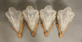 A set of four 1920's glass Art Deco wall lights