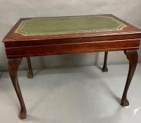 A cutlery table with green leather top on cabriole legs and hinged top opening to Kings pattern