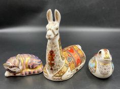 Three Royal Crown Derby paperweights, Kitten, camel and duckling, all three with gold stoppers,