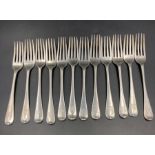 A selection of twelve hallmarked silver dessert forks, with matching Armorial, some Georgian and