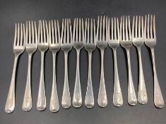 A selection of twelve hallmarked silver dessert forks, with matching Armorial, some Georgian and