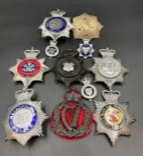 A selection of United Kingdom Police badges and helmet insignia.
