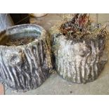 Three garden pots in the form of tree trunks