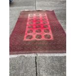 A red ground rug 200 x 300cm