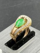 A 14ct gold ring with central Jade stone Size M