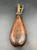 A 19th century leather powder flask