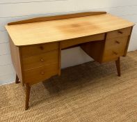 A Mid Century dressing table on tapering legs (H67cm W122cm D49cm)