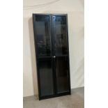 A black painted glass fronted five shelf display cabinet (H202cm W79cm D30cm)