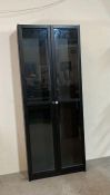 A black painted glass fronted five shelf display cabinet (H202cm W79cm D30cm)