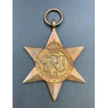 Medals: A boxed Africa Star, 1939-1945 Star and two associated badges.