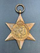 Medals: A boxed Africa Star, 1939-1945 Star and two associated badges.