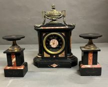 A Connell London slate and marble three piece mantel garniture, mantle clock with two candle holders
