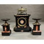 A Connell London slate and marble three piece mantel garniture, mantle clock with two candle holders