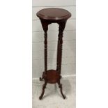 A mahogany torchiere or plant stand with barley twist supports (H100cm)