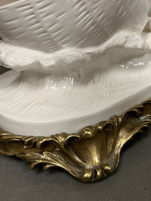 A table centre piece of a cherub pushing a shell into the sea on metal base (H38cm W40cm) - Image 4 of 6