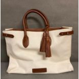 A canvas brown leather handled Ralph Lauren handbag with accompanying Ralph Lauren dust cover