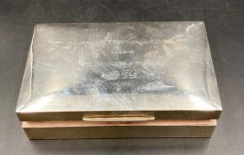 A rectangular silver cigarette box, cedar lined, the lid engraved with inscription Major J H T