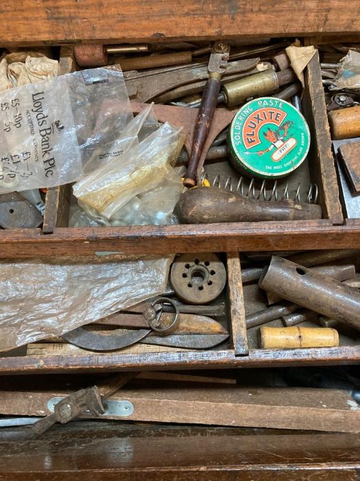 A large vintage wooden steal banded tool box with cast iron handles containing and extensive - Image 7 of 8