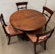 A William IV style mahogany dining table, circular top over a octagonal column and raised on a tri-