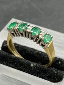A Four stone emerald and diamond ring, marked for 750 yellow gold (Approximate Total weight 3.5g)