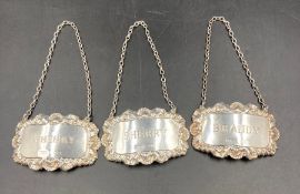 Three silver decanter labels for Brandy, Sherry and Whisky, hallmarked for Birmingham 1973 by J M-A