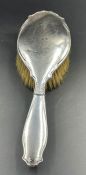 A hallmarked silver backed hairbrush, Birmingham 1919 by E S Barnsley & Co