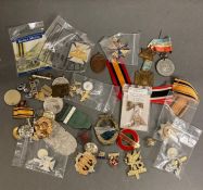 A selection of various military insignia, badges etc. (some replica)
