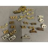 A selection of brass military badges