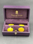 A pair of Asprey silver and yellow enamel Gentleman's cuff links.