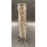 A Chinese silver, Wang Hing, single stem vase on three legs with entwined dragon decoration.