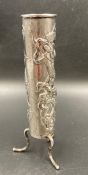 A Chinese silver, Wang Hing, single stem vase on three legs with entwined dragon decoration.