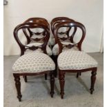 A set of six mahogany balloon back chairs on turned legs