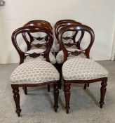 A set of six mahogany balloon back chairs on turned legs