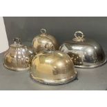 Four silver plated cloches or meat serving domes