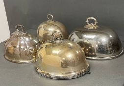 Four silver plated cloches or meat serving domes