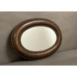 An oval mahogany framed hall mirror 53X48