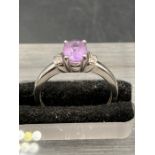 A 9ct white gold Kunzite style ring with diamond shoulders.Size L